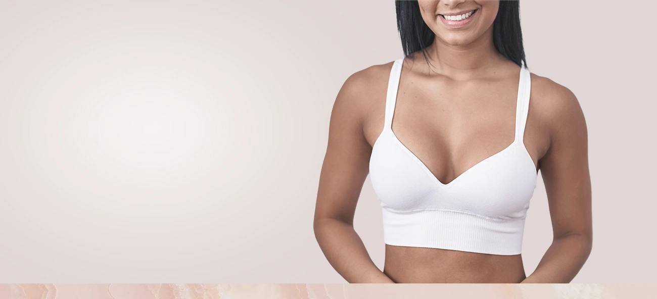 Smiling woman in bra after natural fat transfer