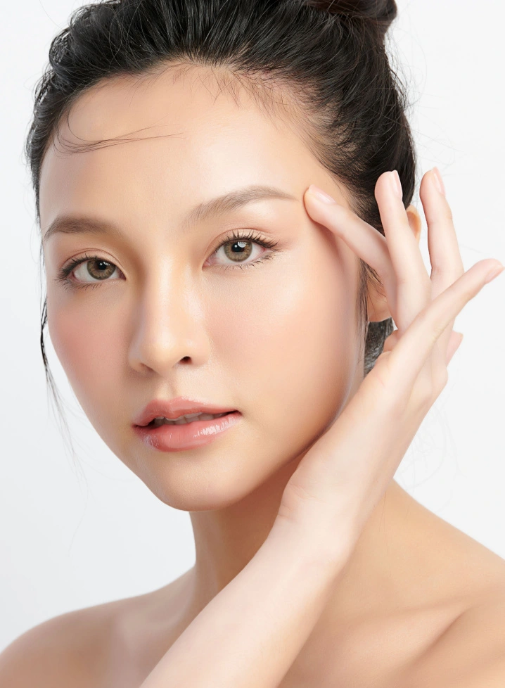 young beautiful woman with flawless, glowing, and clear skin